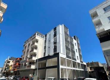One bedroom apartment, 55m², in a gasified residence under construction in the center of Erdemli ID-15028 фото-14