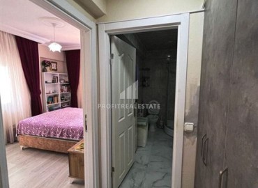 Inexpensive furnished one bedroom apartment, 55m², in an urban building in Mahmutlar, Alanya ID-15036 фото-2