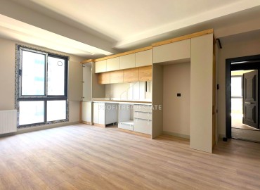 Двухкомнатная квартира, 55м², с чистовой отделкой в малоквартирной резиденции в Мезитли, Мерсин ID-15071 фото-4
