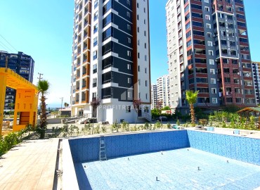 One bedroom apartment, 55m², in a residence with facilities in the final stage of construction in Teje, Mersin ID-15117 фото-1
