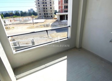One bedroom apartment, 55m², in a residence with facilities in the final stage of construction in Teje, Mersin ID-15117 фото-13