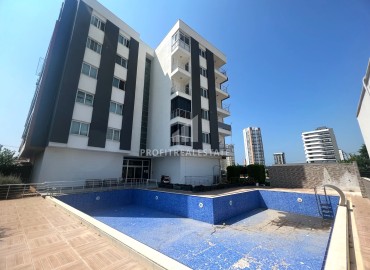 Furnished one-bedroom apartment, 60m², in a residence with a swimming pool, 300m from the sea in the Davultepe area of Mersin ID-15120 фото-1