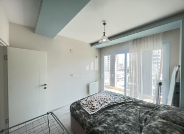 Меблированная двухкомнатная квартира, 60м², в комплексе с бассейном, в 300м от моря в районе Мерсина Давултепе ID-15120 фото-12