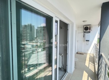 Меблированная двухкомнатная квартира, 60м², в комплексе с бассейном, в 300м от моря в районе Мерсина Давултепе ID-15120 фото-14