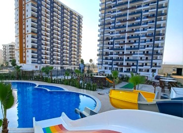 Comfortable two-bedroom apartment, 115m², in a residence with good facilities in the Tomyuk area of Mersin ID-15130 фото-1