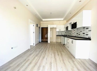 Апартаменты с одной спальней, 55м², в строящемся комплексе с бассейном в районе Томюк, Мерсин ID-15172 фото-6