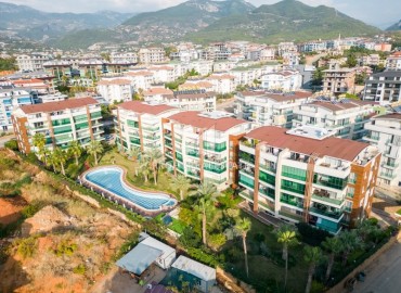 Cozy apartment 1+1, 65m², with glazed balcony, in a residence with extensive facilities in Oba, Alanya ID-15174 фото-1