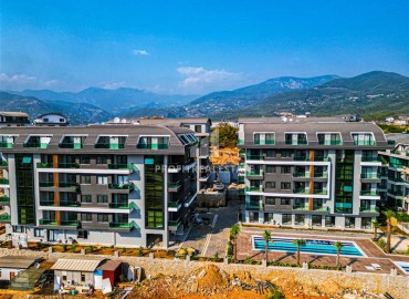 One-room apartment, 50 m², fully finished, in a new residence with facilities in the Oba area, Alanya ID-15200 фото-1