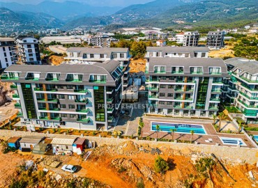 One-room apartment, 50 m², fully finished, in a new residence with facilities in the Oba area, Alanya ID-15200 фото-2