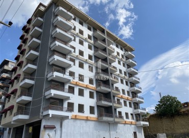 Inexpensive one-bedroom apartment 58m², unfurnished, in the final stage of construction in Avsallar, Alanya ID-15263 фото-1