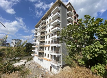 Inexpensive one-bedroom apartment 58m², unfurnished, in the final stage of construction in Avsallar, Alanya ID-15263 фото-5