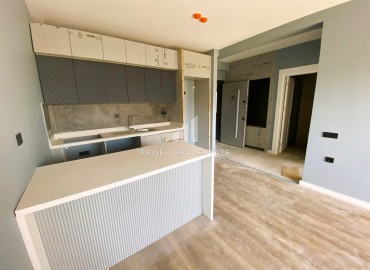 Новая двухкомнатная квартира, 65м², в комфортабельной новой резиденции 2023 года в Арпачбахшиш, Эрдемли ID-15288 фото-6