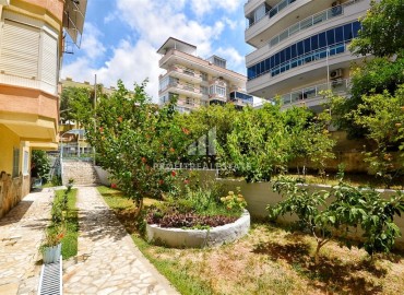Inexpensive furnished one-bedroom apartment 65m², with a separate kitchen, 300 meters from the sea, Mahmutlar, Alanya ID-15309 фото-19