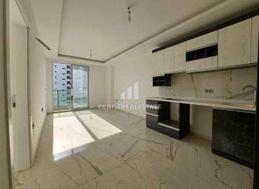Новая квартира с одной спальней, 58м². в новостройке с обширной инфраструктурой в районе Махмутлар, Алания ID-15311 фото-3
