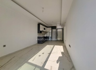 Новая квартира с одной спальней, 58м². в новостройке с обширной инфраструктурой в районе Махмутлар, Алания ID-15311 фото-4