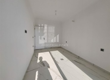 Новая квартира с одной спальней, 58м². в новостройке с обширной инфраструктурой в районе Махмутлар, Алания ID-15311 фото-6