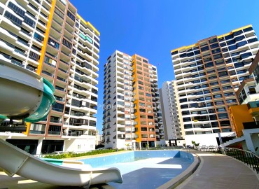 Elegant apartment 2+1, 130m², in a luxury new building in Arpacbakhsis, Erdemli, 250m from the sea ID-15323 фото-1