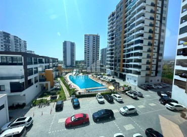 Furnished one-bedroom apartment, 60m², in a new premium residence in Arpacbakhsis, Erdemli ID-15324 фото-12