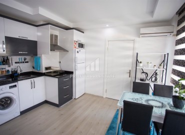 Inexpensive 1+1 apartment, with furniture and appliances, in a residential building without a swimming pool, Mahmutlar, Alanya, 55 m2 ID-15330 фото-5