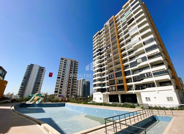 Ready to move in, one bedroom apartment, 60m², in a comfortable new residence in Arpacbakhsis, Erdemli ID-15346 фото-1