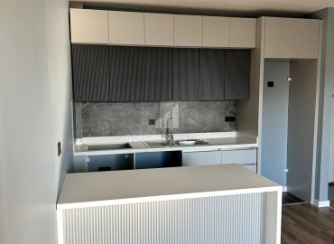Новая квартира с одной спальней, 65м², в комплексе премиум класса в Арпачбахшиш, Эрдемли ID-15347 фото-7