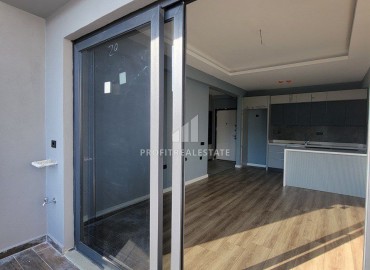 Новая квартира с одной спальней, 65м², в комплексе премиум класса в Арпачбахшиш, Эрдемли ID-15347 фото-11