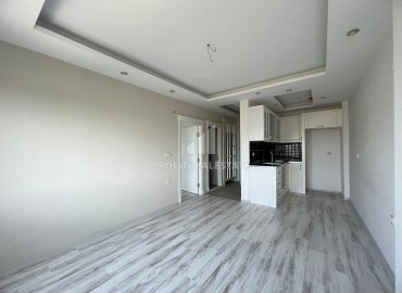 Elegant one-bedroom apartment, 55m², in a comfortable residence in the Tomyuk area, Mersin ID-15375 фото-5