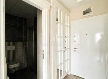 Элегантная двухкомнатная квартира, 55м², в комфортабельном комплексе в районе Томюк, Мерсин ID-15375 фото-12