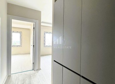 Квартира с одной спальней, 60м², в уютном новом комплексе в районе Томюк, Мерсин ID-15377 фото-3