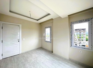 Квартира с одной спальней, 60м², в уютном новом комплексе в районе Томюк, Мерсин ID-15377 фото-10