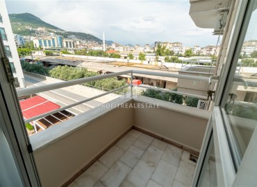 Alanya center: furnished 1+1 apartment with two balconies, 70m², mountain views with designer interior ID-15393 фото-11