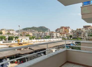Alanya center: furnished 1+1 apartment with two balconies, 70m², mountain views with designer interior ID-15393 фото-14