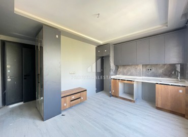 Двухкомнатная квартира, 50м², с чистовой отделкой в малоквартирной резиденции в Мезитли, Мерсин ID-15460 фото-2