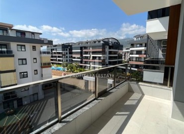 Unfurnished one bedroom apartment 55 m², with kitchen unit, in a new residential residence with facilities, Oba, Alanya ID-15546 фото-10