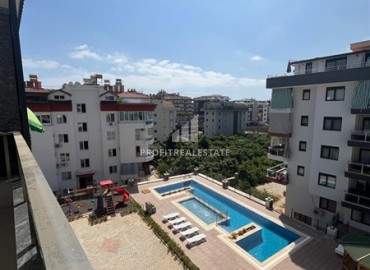 Unfurnished one bedroom apartment 55 m², with kitchen unit, in a new residential residence with facilities, Oba, Alanya ID-15546 фото-11