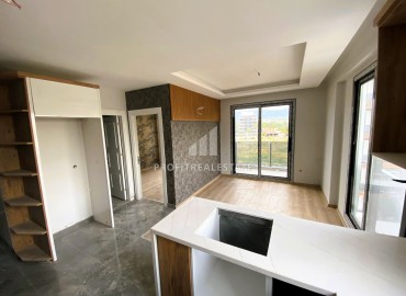 Stylish one bedroom apartment, 55m², in a luxury residence under construction in Erdemli, Arpacbakhsis ID-15611 фото-2