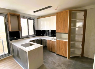 Stylish one bedroom apartment, 55m², in a luxury residence under construction in Erdemli, Arpacbakhsis ID-15611 фото-4
