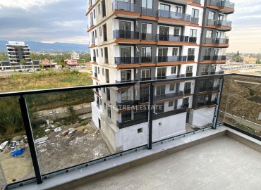 Стильные двухкомнатные апартаменты, 55м², в элитном комплексе на этапе строительства в Эрдемли, Арпачбахшиш ID-15611 фото-15