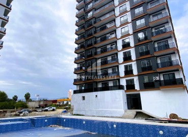 Stylish one bedroom apartment, 55m², in a luxury residence under construction in Erdemli, Arpacbakhsis ID-15611 фото-16