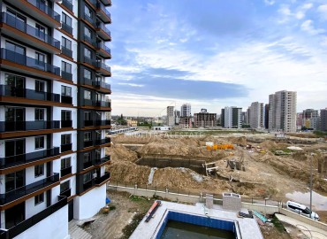 Стильные двухкомнатные апартаменты, 55м², в элитном комплексе на этапе строительства в Эрдемли, Арпачбахшиш ID-15611 фото-20