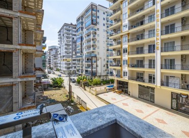 One bedroom apartment, 55m², in a residence with an excellent location under construction in the Alanya area - Mahmutlar ID-15624 фото-12
