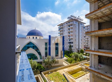 One bedroom apartment, 55m², in a residence with an excellent location under construction in the Alanya area - Mahmutlar ID-15624 фото-13