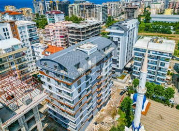 One bedroom apartment, 55m², in a residence with an excellent location under construction in the Alanya area - Mahmutlar ID-15624 фото-15