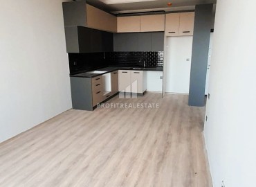 Комфортабельная квартира с одной спальней, 71м², в новом комплексе в районе Томюк, Мерсин ID-15637 фото-2