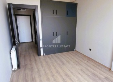 Комфортабельная квартира с одной спальней, 71м², в новом комплексе в районе Томюк, Мерсин ID-15637 фото-7
