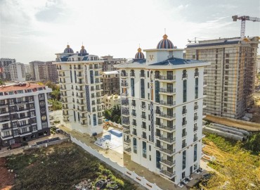 Двухкомнатная квартира, 46м², в новом комплексе премиум класса на окончательном этапе строительства в Махмутларе, Алания ID-15642 фото-1