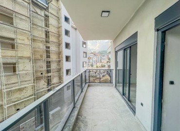 Inexpensive one bedroom apartment 50 m², unfurnished, fully finished, in a new building with facilities, Ciplakli, Alanya ID-15643 фото-10
