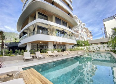 Furnished one bedroom apartment, 50m², in a premium new building in the center of Alanya, near Cleopatra Beach ID-15731 фото-1
