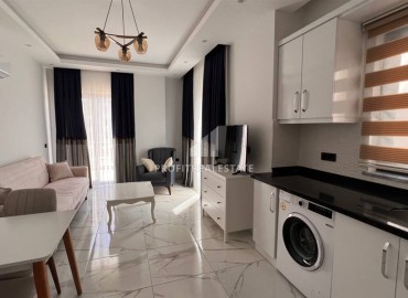 Уютная квартира с одной спальней, 51м². в новостройке с инфраструктурой в районе Махмутлар, Алания ID-15745 фото-4