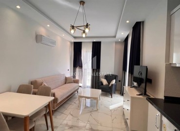 Уютная квартира с одной спальней, 51м². в новостройке с инфраструктурой в районе Махмутлар, Алания ID-15745 фото-5